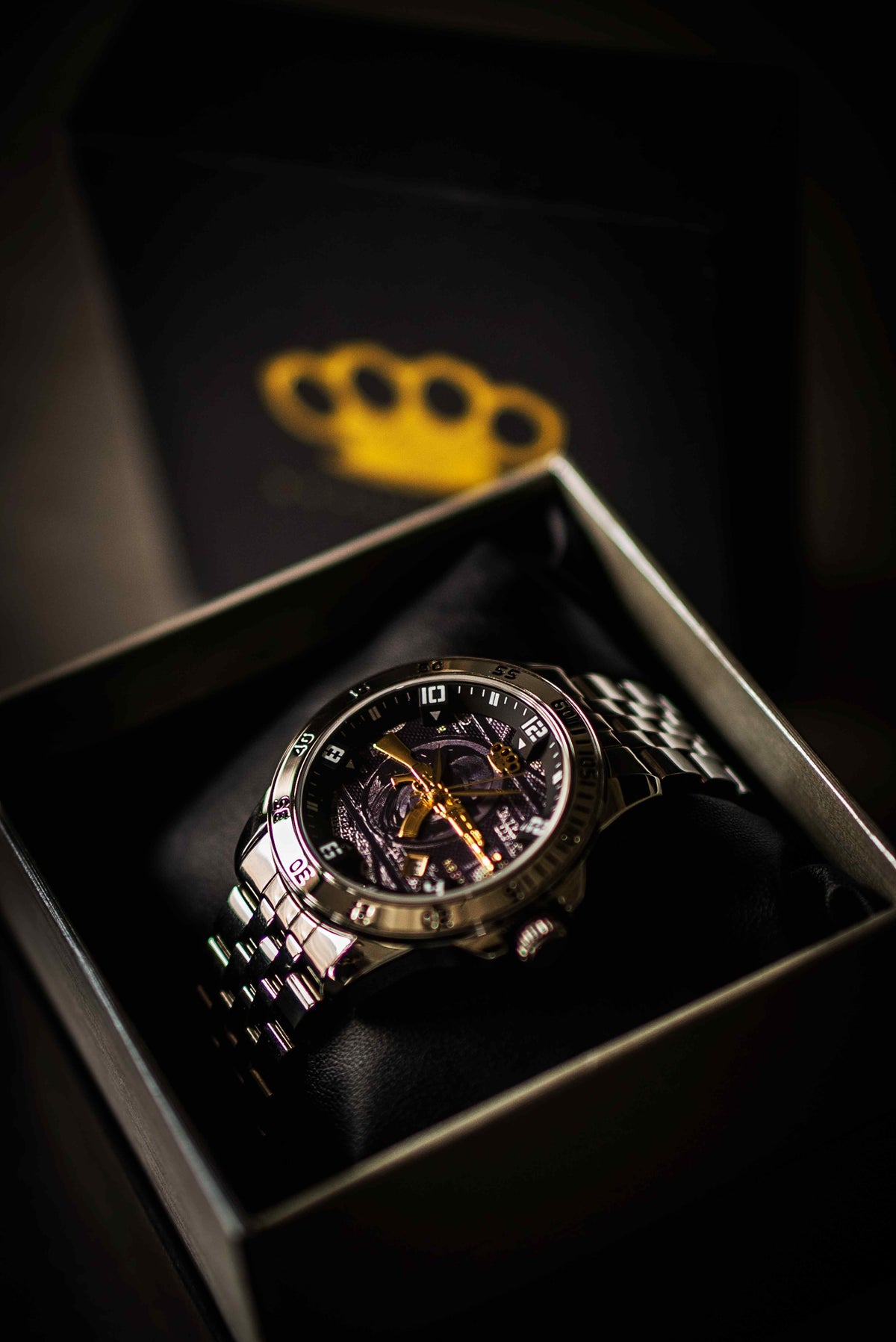 Silver MVL AK47 watch in an open gift box with gold MVL logo