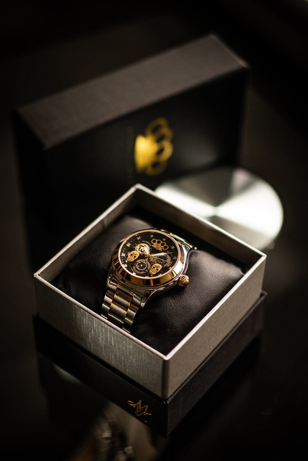 MVL Double skull automatic watch in silver/gold in the open gift box with gold MVL logo