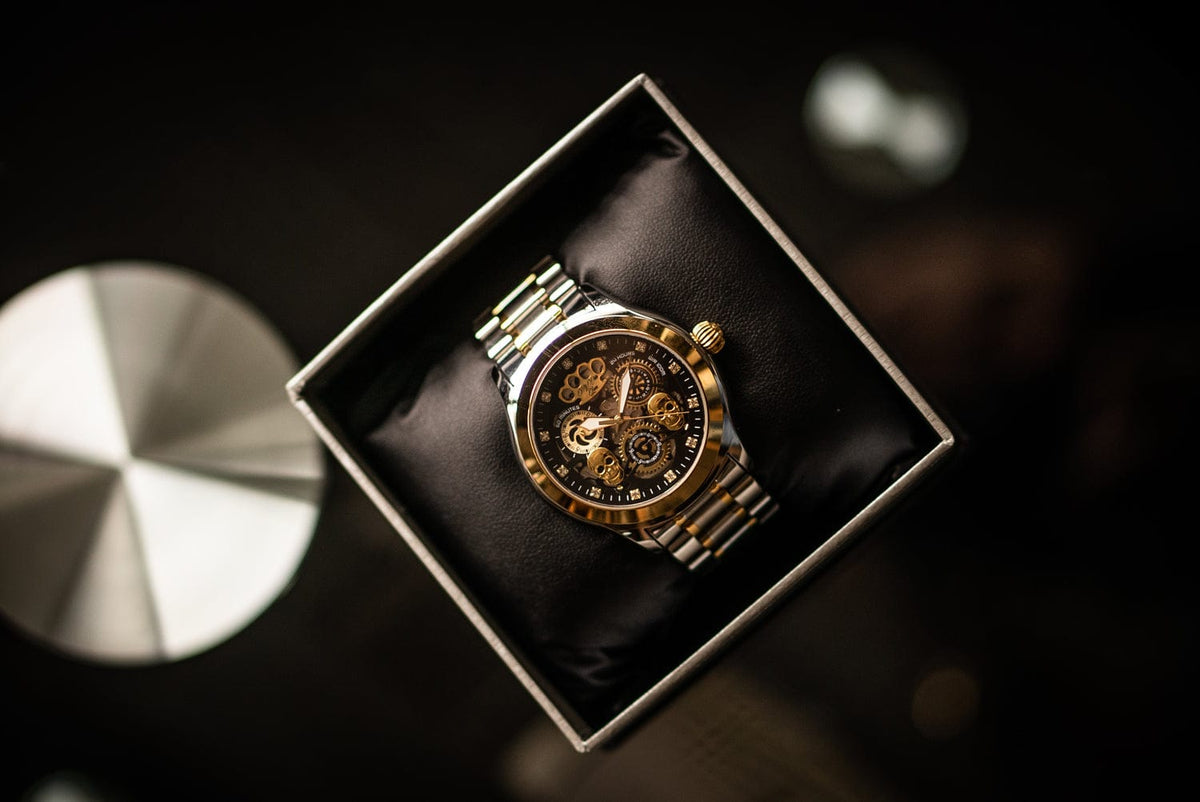 MVL Double skull automatic watch in silver/gold in the open box, from above