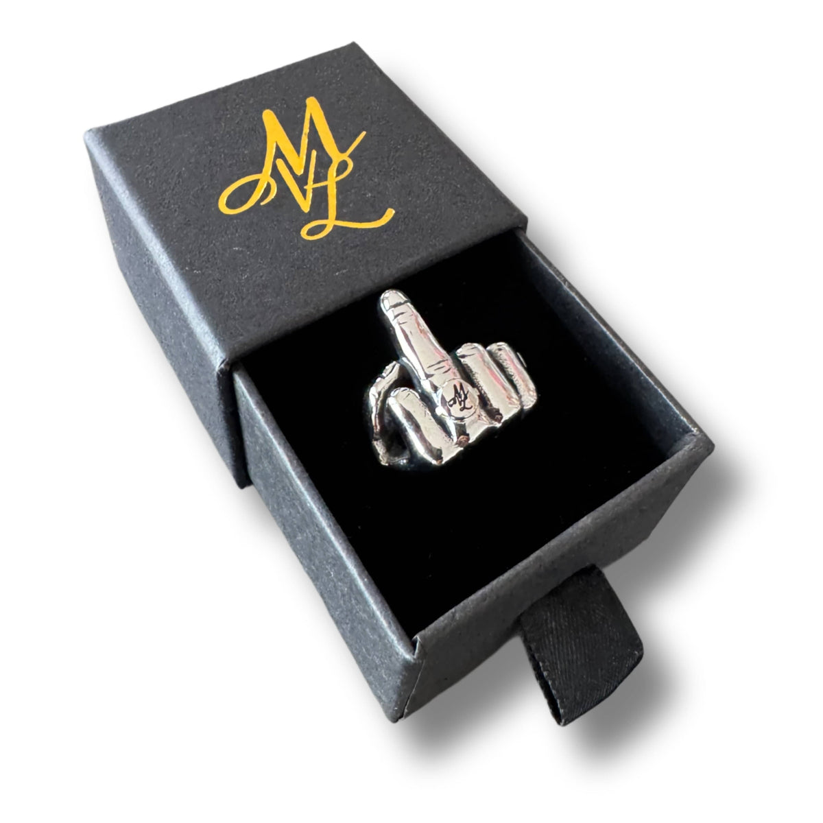 Mi Vida Loca middle finger ring in silver, stainless steel, in the open black ring box with MVL monogram