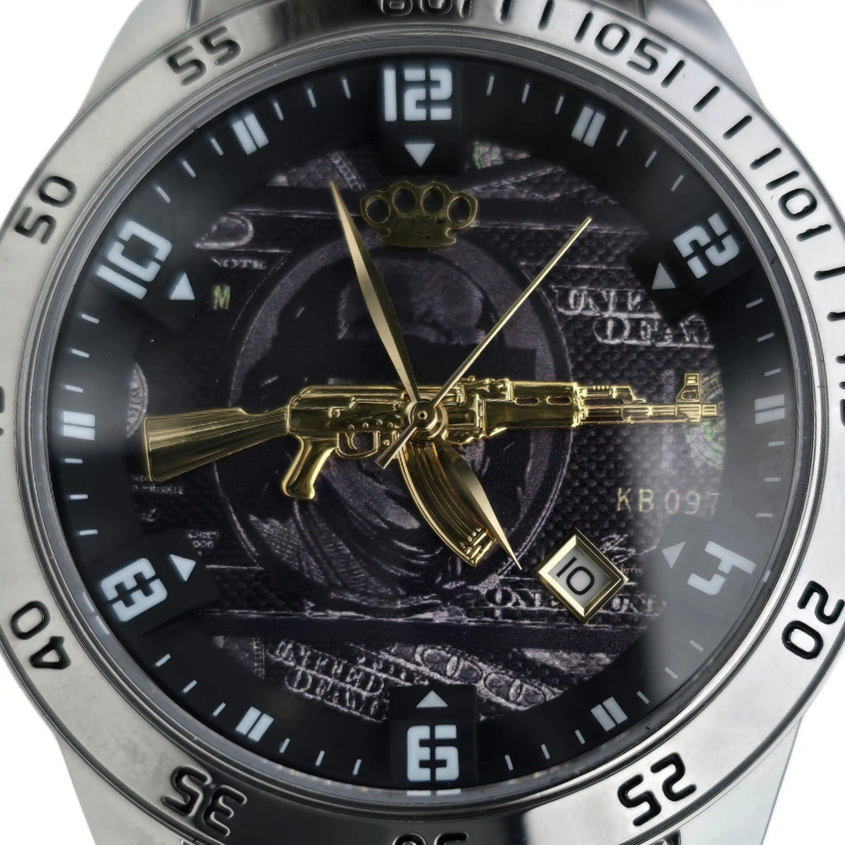 Close-up of the dial of the silver MVL AK47 watch with gold AK47 and date window