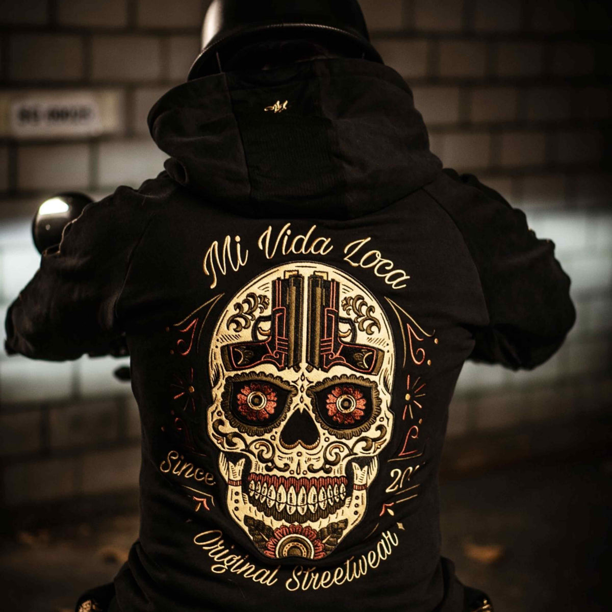 Close-up of the Sugar skull embroidery with Mi Vida Loca and Original Streetwear on the back