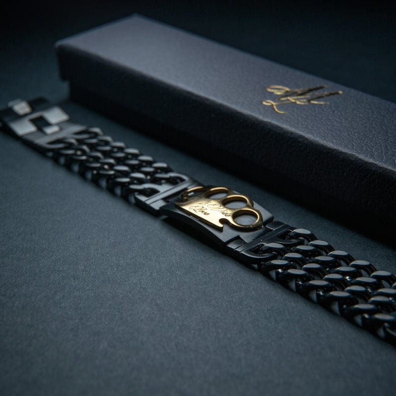 Mi Vida Loca Armband schwarz/gold, schwarzes Gliederarmband mit goldenem MVL-Logo neben der schwarzen Box